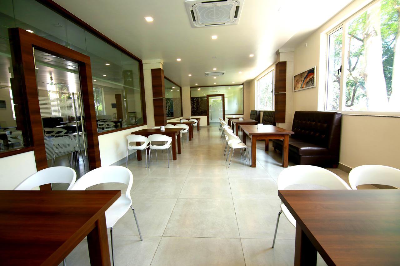 Palguni Residency Hotel Hassan Exterior photo
